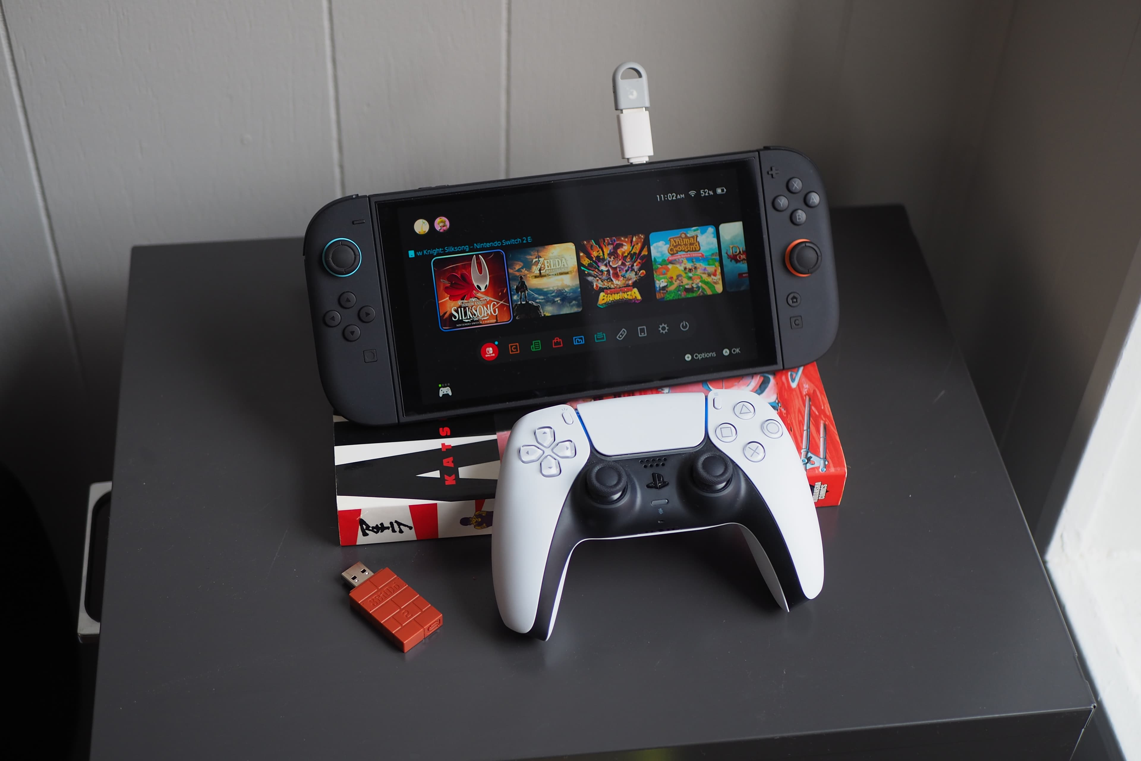 GuliKit’s tiny USB dongle lets you connect your PS5 controller to your Switch 2